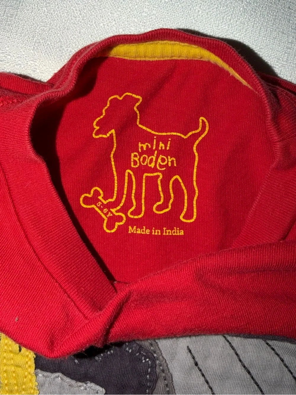 Two Mini Boden appliqué T-shirts, and two pair of shorts size 5/6